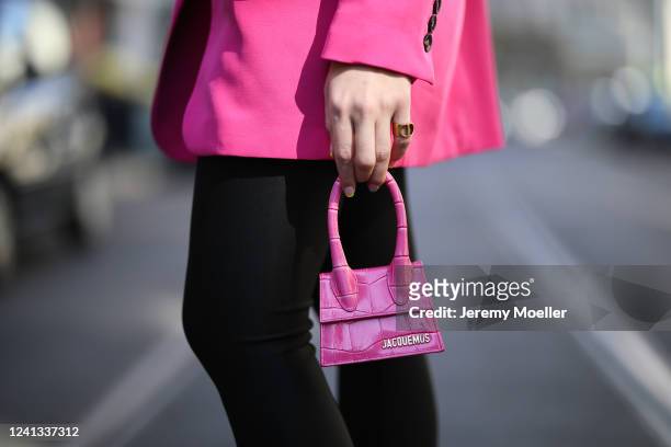 Sonia Lyson wearing &other stories pants, Zara blazer, Dior ring and Jacquemus mini pink bag on May 26, 2020 in Berlin, Germany.