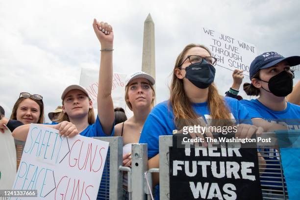 June 11: People hold up signs and listen to speakers at the March for our Lives rally against gun violence at the National Mall in Washington, D.C....