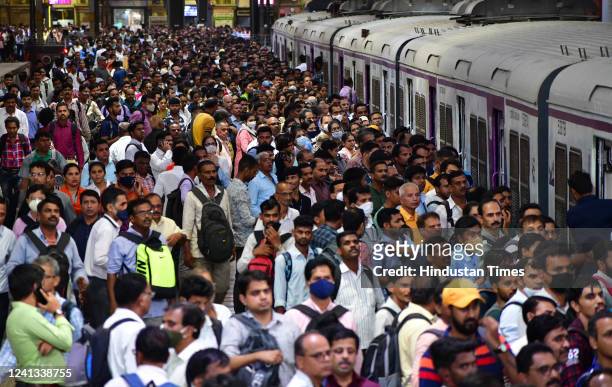 Massive crowd of commuters waiting on the platform for a suburban local train, at CSMT Station on June 13, 2022 in Mumbai, India.