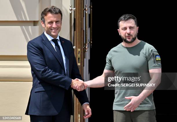 Ukrainian President Volodymyr Zelensky shakes hand with President of France Emmanuel Macron prior a meeting with European Union leaders in Mariinsky...