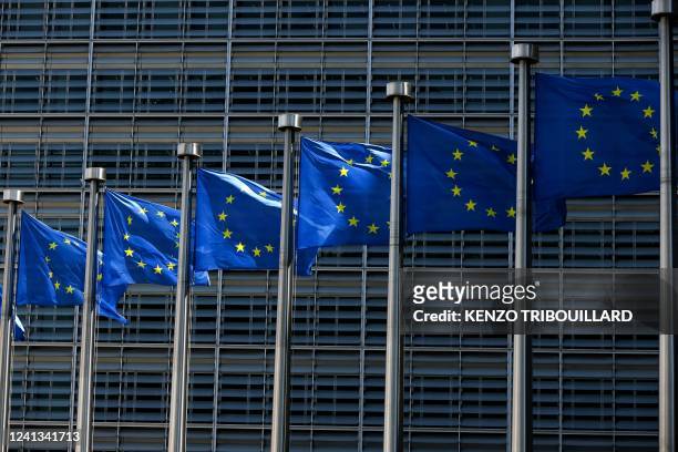 European Union flags fly outside the European Commission building in Brussel on June 16, 2022.
