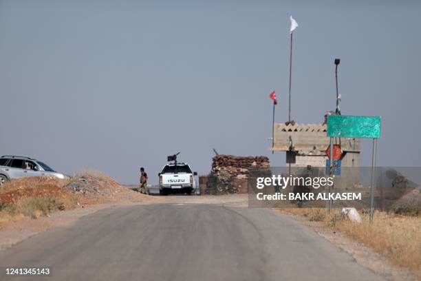 Security forces block an entrance to the village of Humayra, where US coalition forces conducted an overnight airborne operation, in the Ghandoura...