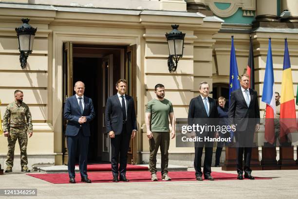 In this handout photo provided by the German Government Press Office , German Chancellor Olaf Scholz stands in front of the Presidential Palace next...