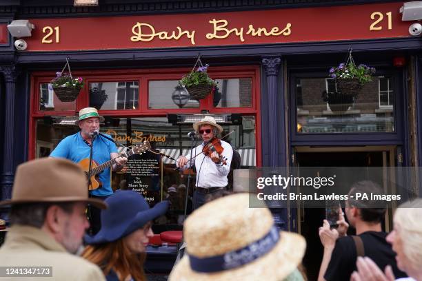 People attend an event at Davy Byrnes pub in Dublin's city centre as Bloomsday celebrations continue. Bloomsday is a celebration of the life of Irish...