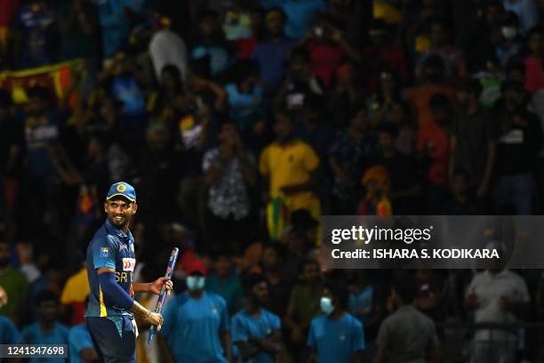 Sri Lanka's Captain Dasun Shanaka celebrates with teammates after Sri Lanka won by 26 runs during the second one-day international cricket match...