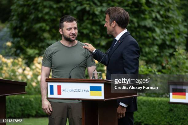 Ukrainian President Volodymyr Zelensky and Frances President Emmanuel Macron talk after a press conference on June 16, 2022 in Kyiv, Ukraine. The...