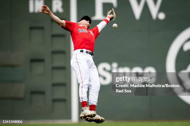 Trevor Story of the Boston Red Sox misses a catch during the third inning of a game against the Oakland Athletics on June 16, 2022 at Fenway Park in...