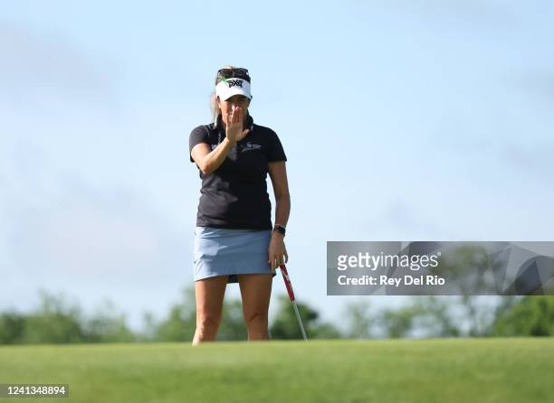 Gerina Mendoza lines up a putt on the first green during round one of the Meijer LPGA Classic at Blythefield Country Club on June 16, 2022 in Grand...