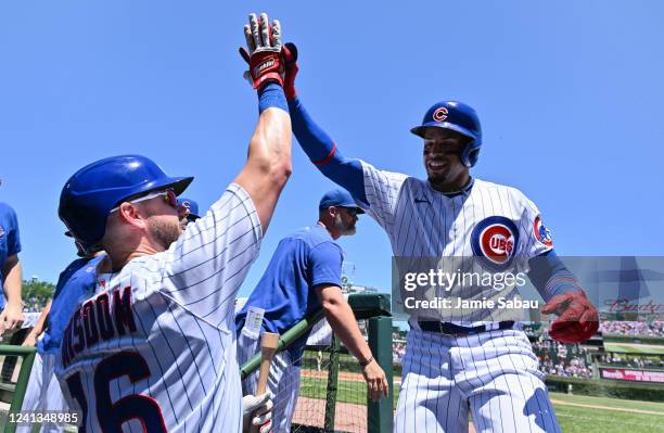 Christopher Morel of the Chicago Cubs celebrates with Patrick Wisdom after hitting a lead off home run in the first inning against the San Diego...