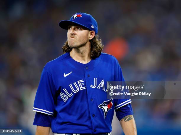 Kevin Gausman of the Toronto Blue Jays leaves the field in the third inning after being pulled from the game during a MLB game against the Baltimore...