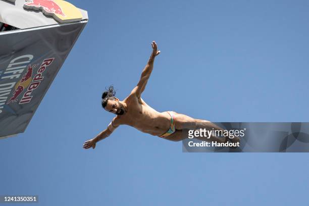 In this handout image provided by Red Bull, Catalin Preda of Romania dives from the 27.5 metre platform during the training day of the second stop of...