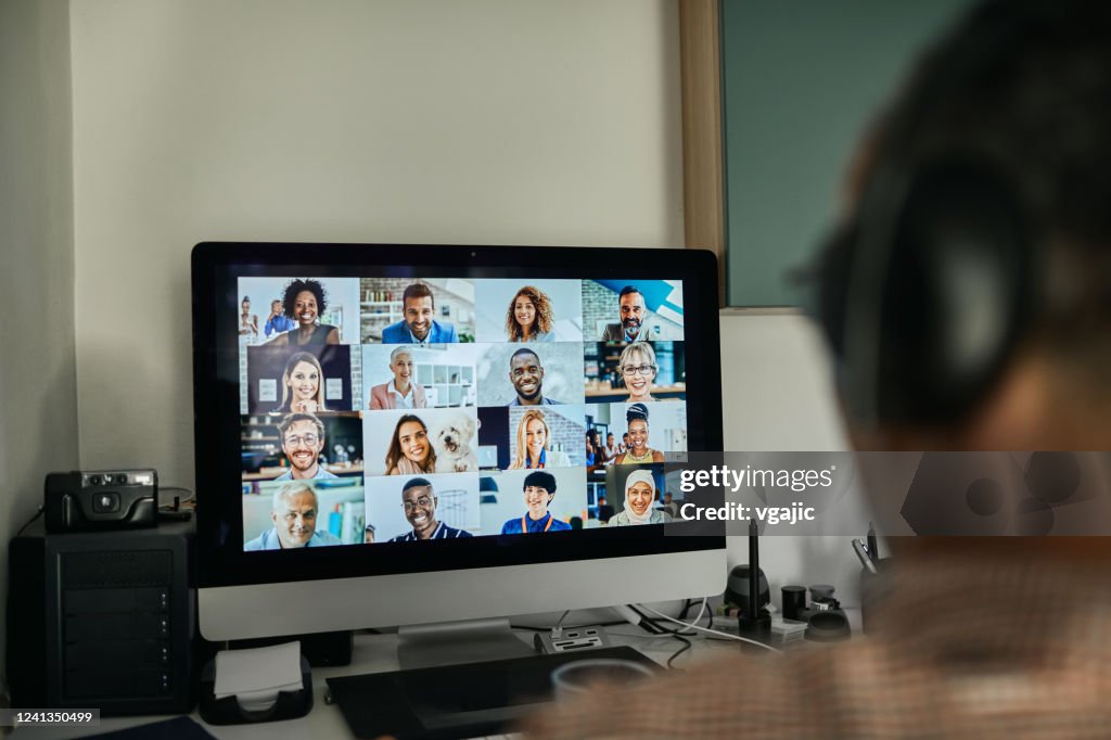 Businessman Working With Colleague Through Video Conferencing