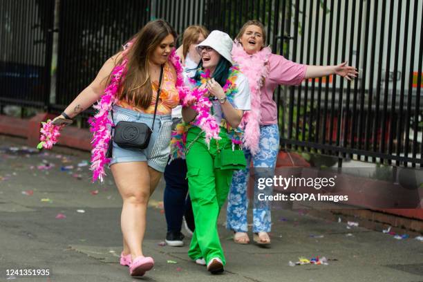 Harry Styles fans walking to where the concert is taking place. Harry Styles fans make their way into the Old Trafford Cricket Ground concert. Many...