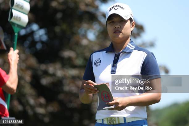 Haru Nomura of Japan walks off the first green during round one of the Meijer LPGA Classic at Blythefield Country Club on June 16, 2022 in Grand...