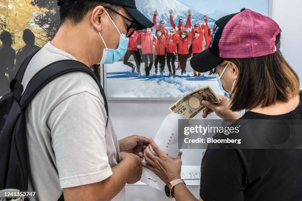 Customers count Japanese 10,000 yen banknotes at the Birdy Exchange in Hong Kong, China, on Wednesday, June 16, 2022. Amateur investors have been...