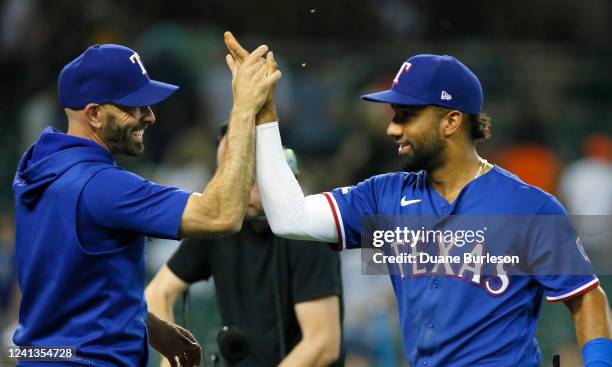 Manager Chris Woodward and Ezequiel Duran of the Texas Rangers celebrate a 3-1 win over the Detroit Tigers at Comerica Park on June 16 in Detroit,...