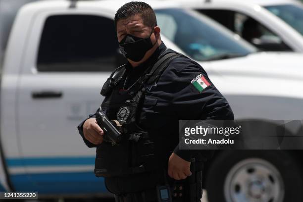 Police officer investigates the crime scene at the Dennys restaurant after an armed attack in Ciudad Juarez, Mexico on June 16, 2022. A group of...
