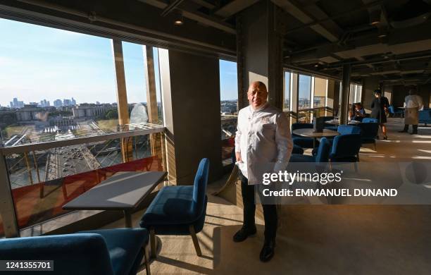 French chef Thierry Marx poses for a photo in Madame Brasserie, his latest restaurant on the first floor of the Eiffel Tower in Paris, on June 15,...