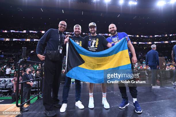 Klay Thompson of the Golden State Warriors poses for a photo with his father Mychel Thompson and his brother Mychal Thompson Jr. After Game Six of...