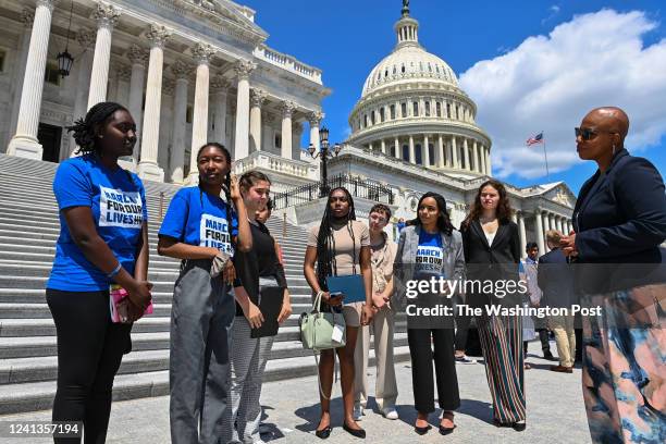 Zoe Touray of Oxford, Michigan, far left, and members of the March For Our Lives movement, speak to Rep. Ayanna Pressley far right, outside the U.S....