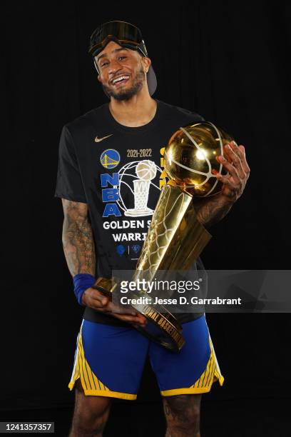 Gary Payton II of the Golden State Warriors poses for a portrait with the Larry OBrien Trophy after winning Game Six of the 2022 NBA Finals against...