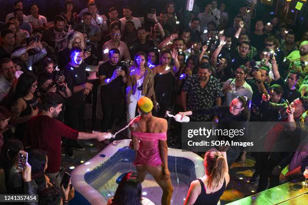 Drag performer La Galego gestures while performing during the drag race event at the Living LGBTQ discotheque. The month of June celebrates Lesbian,...