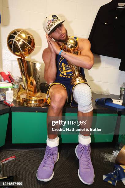 Stephen Curry of the Golden State Warriors celebrates with the Bill Russell NBA Finals MVP Award after Game Six of the 2022 NBA Finals on June 16,...