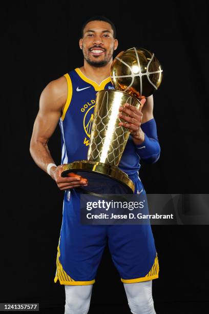 Otto Porter Jr. #32 of the Golden State Warriors poses for a portrait with the Larry OBrien Trophy after winning Game Six of the 2022 NBA Finals...