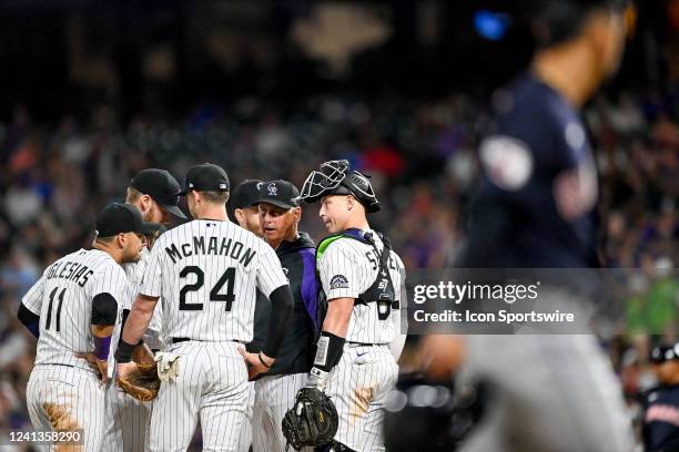 Colorado Rockies manager Bud Black visits Colorado Rockies relief pitcher Daniel Bard on the mound during a game between the Cleveland Guardians and...