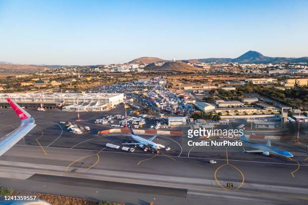 Aerial view of Heraklion airport with a LOT Polish Airlines and a TUI Boeing 737-800 aircraft parked at the tarmac. TUI Boeing 737 MAX aircraft as...