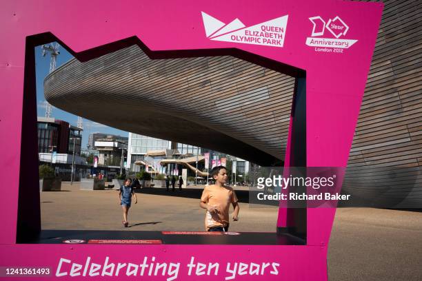 Ten years after the London 2012 Olympics were based here at Stratford, is an anniversary frame which features the Aquatic Centre in The Queen...