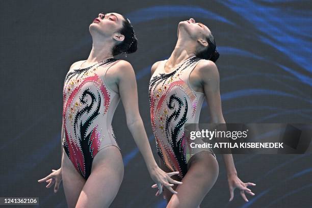 Cuba's Gabriela Alpajon Reyes and Cuba's Stephany Urbina Bernal competes in the preliminaries for the women's duet technical artistic swimming event...