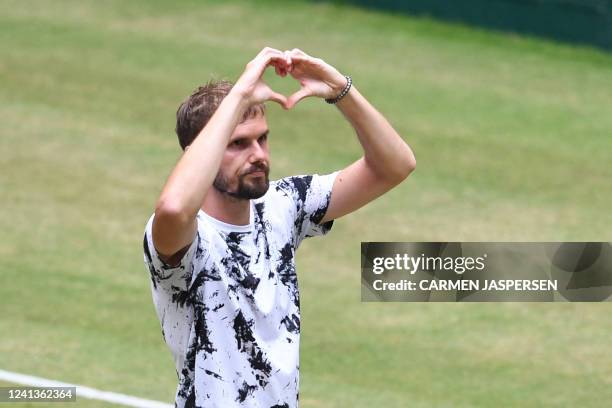 Germany's Oscar Otte reacts after winning his match against Russia's Karen Khachanov at the men's singles quarter final at the ATP 500 Halle Open...