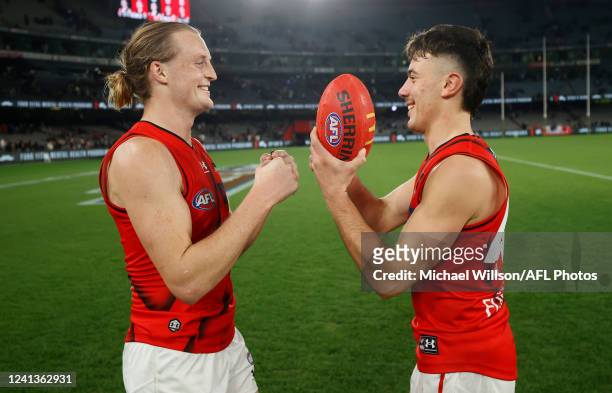 Mason Redman and Massimo DAmbrosio of the Bombers celebrate during the 2022 AFL Round 14 match between the St Kilda Saints and the Essendon Bombers...