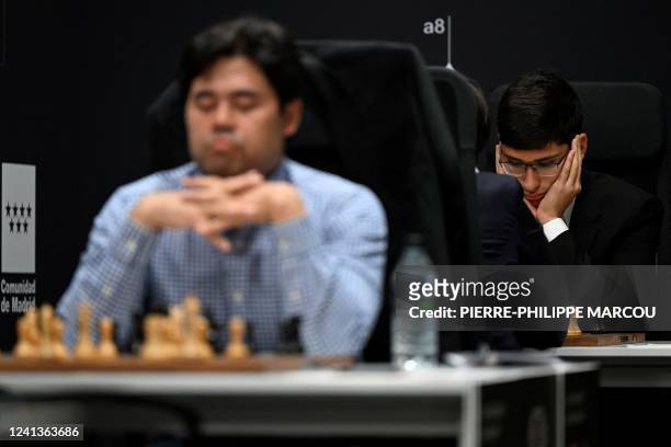 Iranian-French chess grandmaster Alireza Firouzja looks on during the first day of the chess Candidates Tournament FIDE 2022, in Madrid on June 17,...
