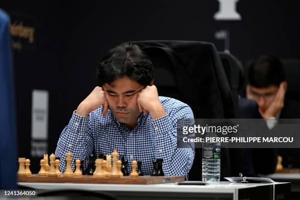 Chess grandmaster Hikaru Nakamura looks on during the first day of the chess Candidates Tournament FIDE 2022, in Madrid on June 17, 2022. - Eight of...