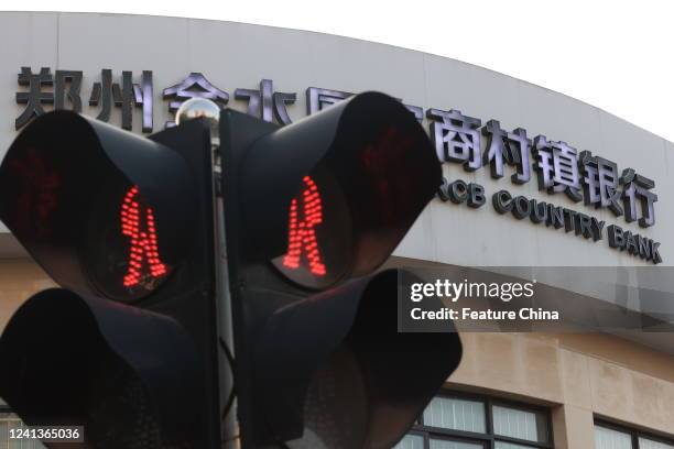 View of an outlet of a rural bank in Zhengzhou city in central China's Henan province Friday, June 17, 2022. Several rural banks in the province have...