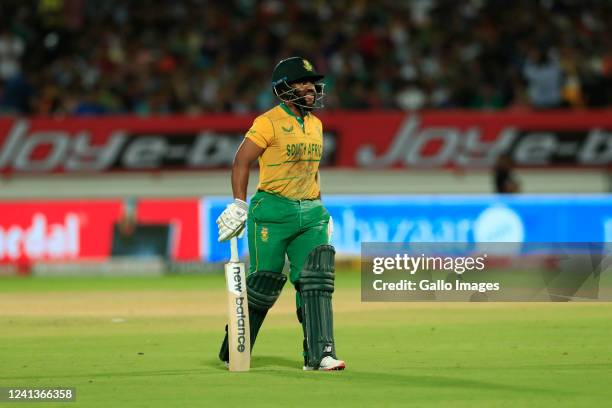 Temba Bavuma of South Africa walk back after retired hurt during the 4th T20 International match between India and South Africa at Saurashtra Cricket...