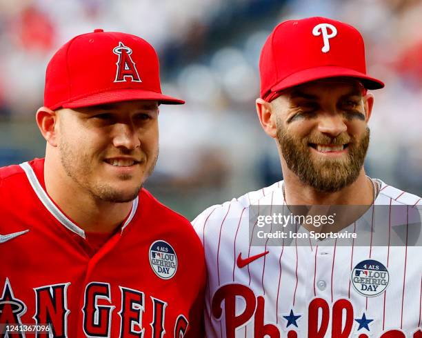 Los Angeles Angels center fielder Mike Trout and Philadelphia Phillies designated hitter Bryce Harper pose for photos on the field prior to the Major...