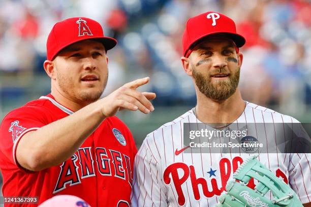 Los Angeles Angels center fielder Mike Trout and Philadelphia Phillies designated hitter Bryce Harper pose for photos on the field prior to the Major...