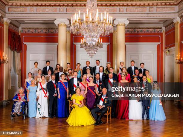 Norway's Princess Ingrid Alexandra poses for a with Norway's Queen Sonja and King Harald and other guests on the occasion of a gala dinner for her...