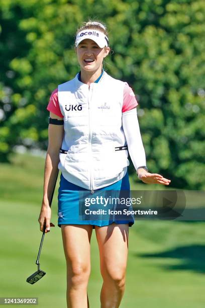 Golfer Nelly Korda talks to Brooke Henderson as she gets ready to putt on the second hole on June 17, 2022 during the Meijer LPGA Classic For Simply...