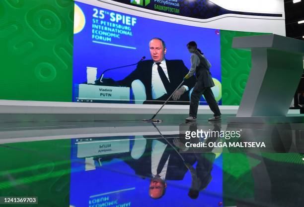 Screen shows Russian President Vladimir Putin speaking during a plenary session of the Saint Petersburg International Economic Forum in Saint...