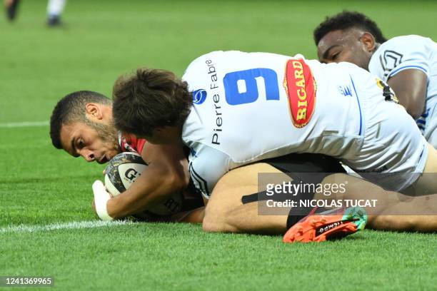 Toulouse's French wing Matthis Lebel scores the opening try during the French Top 14 semi-final rugby union match between Castres Olympique and Stade...