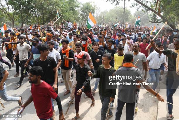 Protester block Khagual road at Danapur during a protest against the Agnipath army recruitment scheme on June 17, 2022 in Patna, India. The violent...