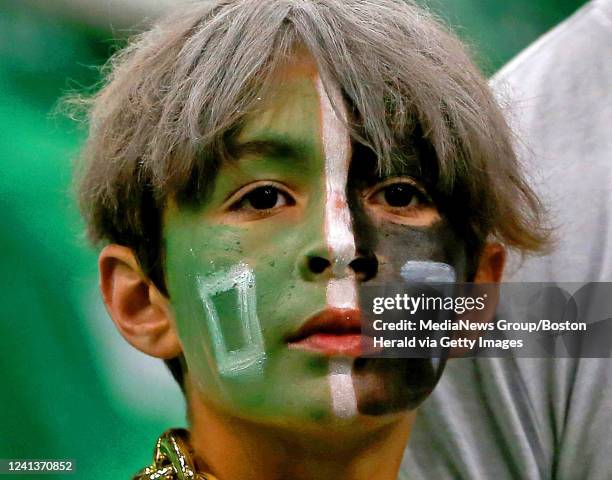 Young fan watches warm-ups before Game 6 of the NBA Finals at the TD Garden on June 16, 2022 in Boston, Massachusetts.