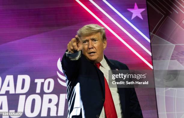 Former U.S. President Donald Trump points to the crowd after giving the keynote address at the Faith & Freedom Coalition during their annual "Road To...