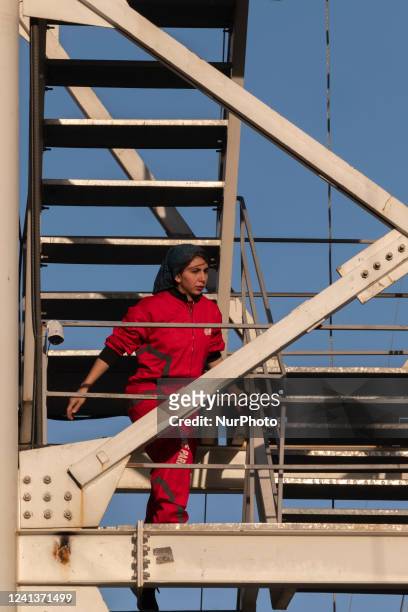 Iranian bungee woman, Sogand Salari-30, climbs from a 40-meter rig during the first Irans acrobatic bungee jumping competition in Adrenaline Park in...