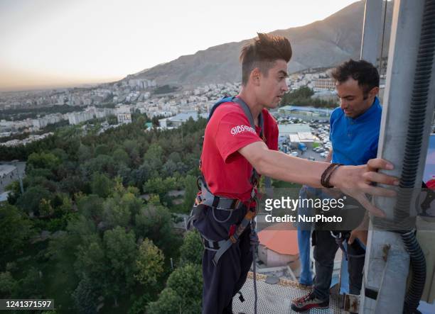 Iranian bungee man, Mahdi Gordan-21 , prepares to perform a bungee jumping from a 40-meter rig during the first Irans acrobatic bungee jumping...