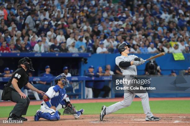 Anthony Rizzo of the New York Yankees watches his ball after hitting a grand slam in the fifth inning of their MLB game against the Toronto Blue Jays...